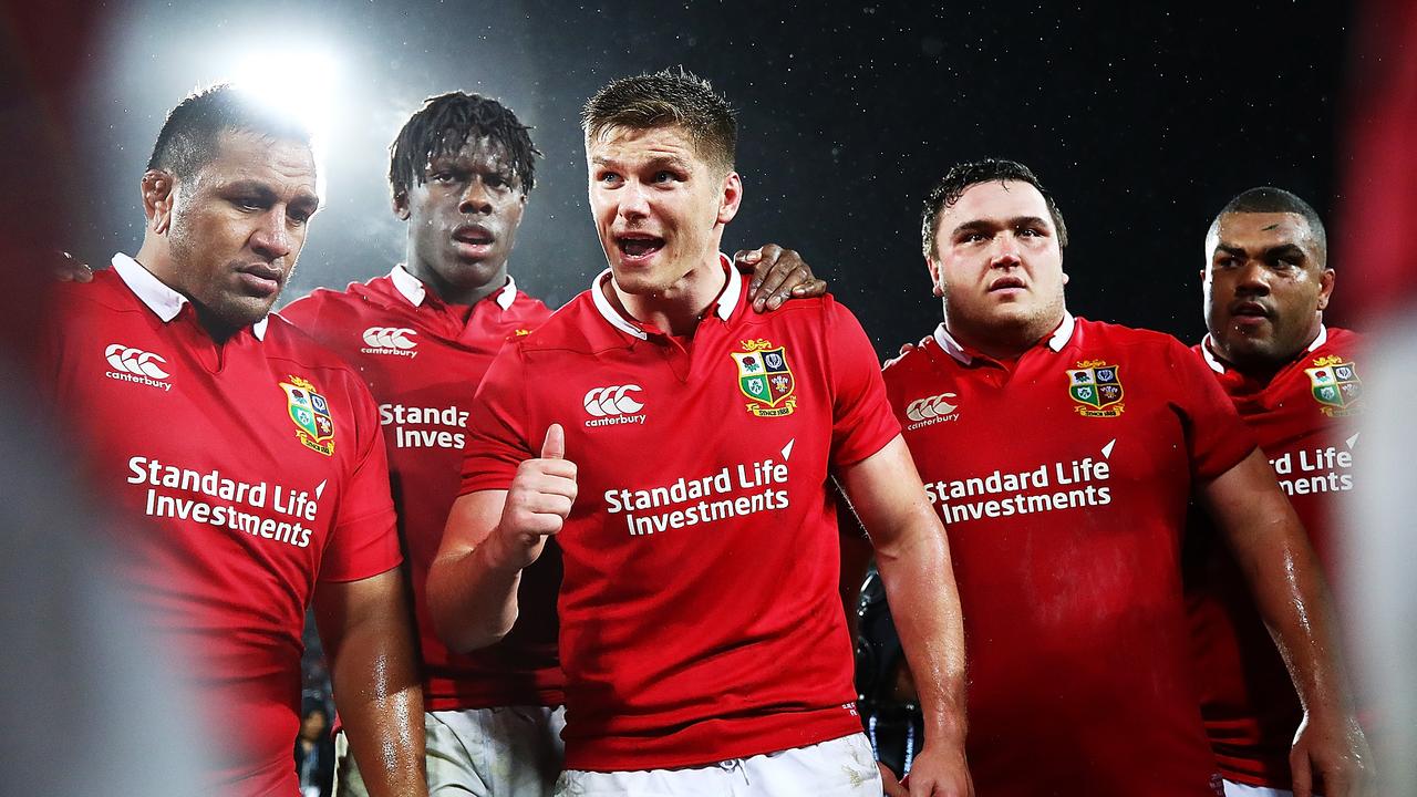 A packed rugby stadium with passionate fans, representing the 'Sea of Red'.