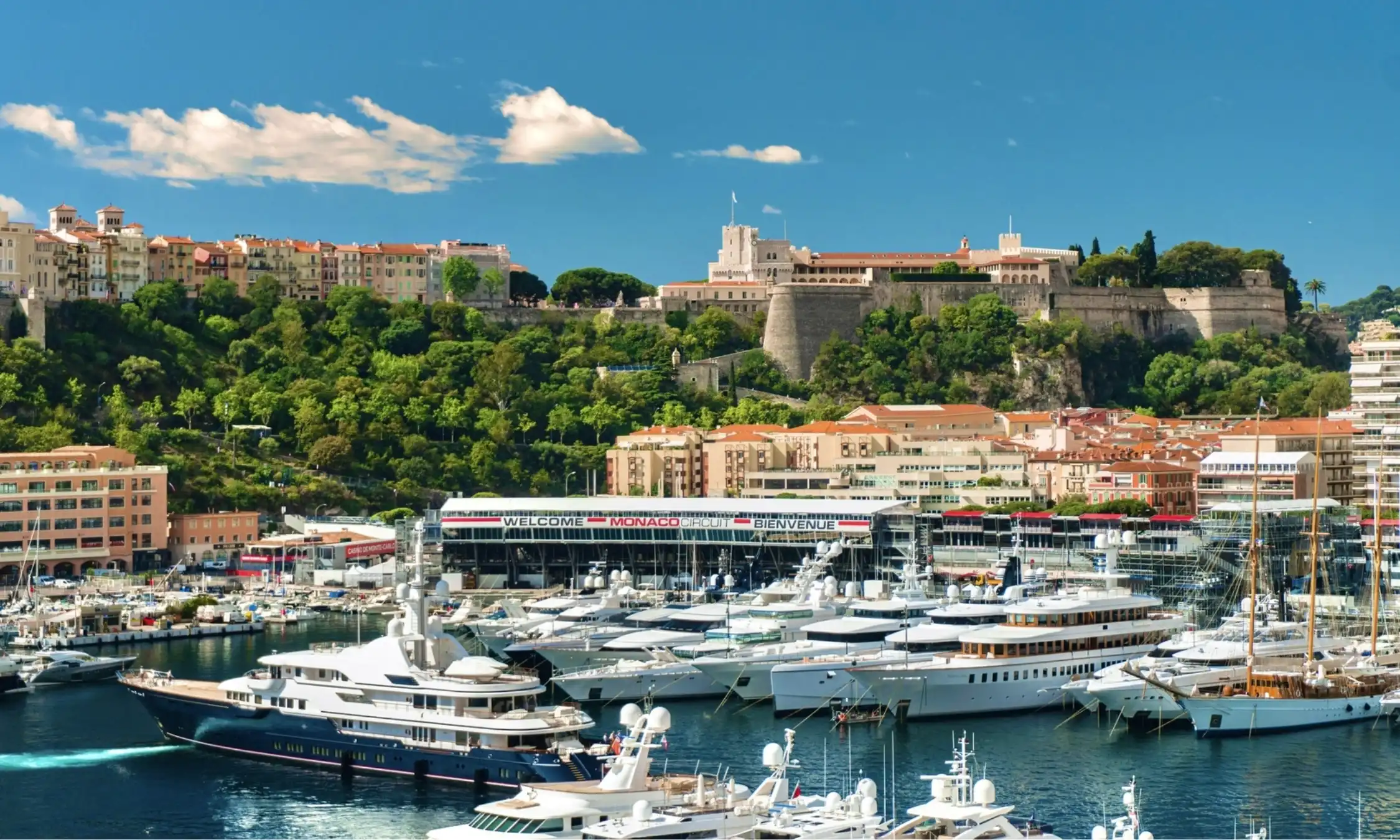 Spectacular aerial view of luxury superyachts moored in Port Hercule during Monaco Grand Prix weekend.