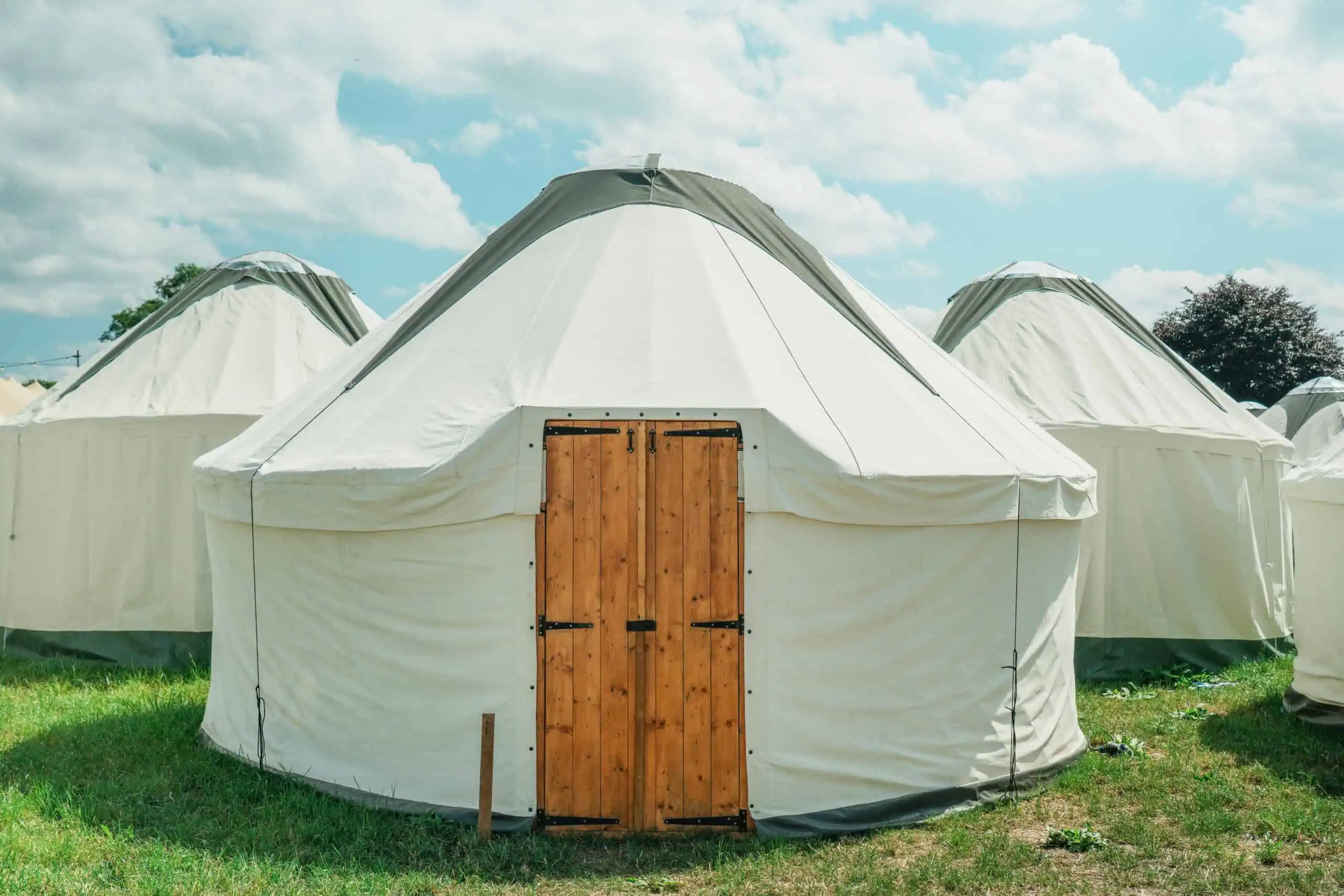Luxury Yurt interior at Glastonbury Festival with spacious living area and comfortable furnishings