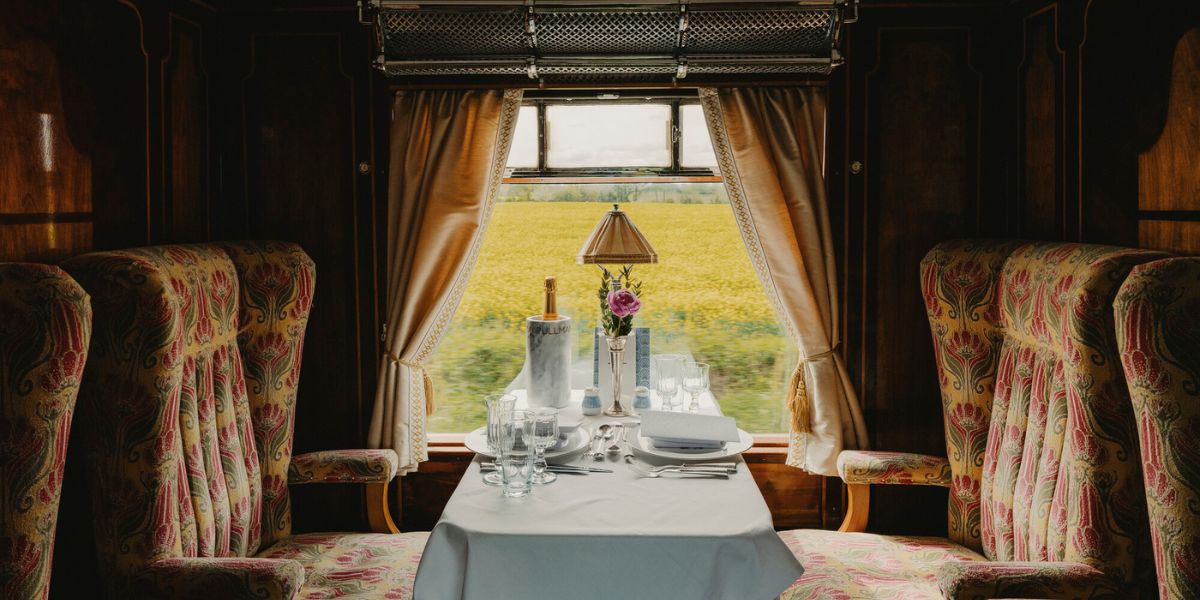 Elegant interior of the British Pullman train carriage with afternoon tea setting