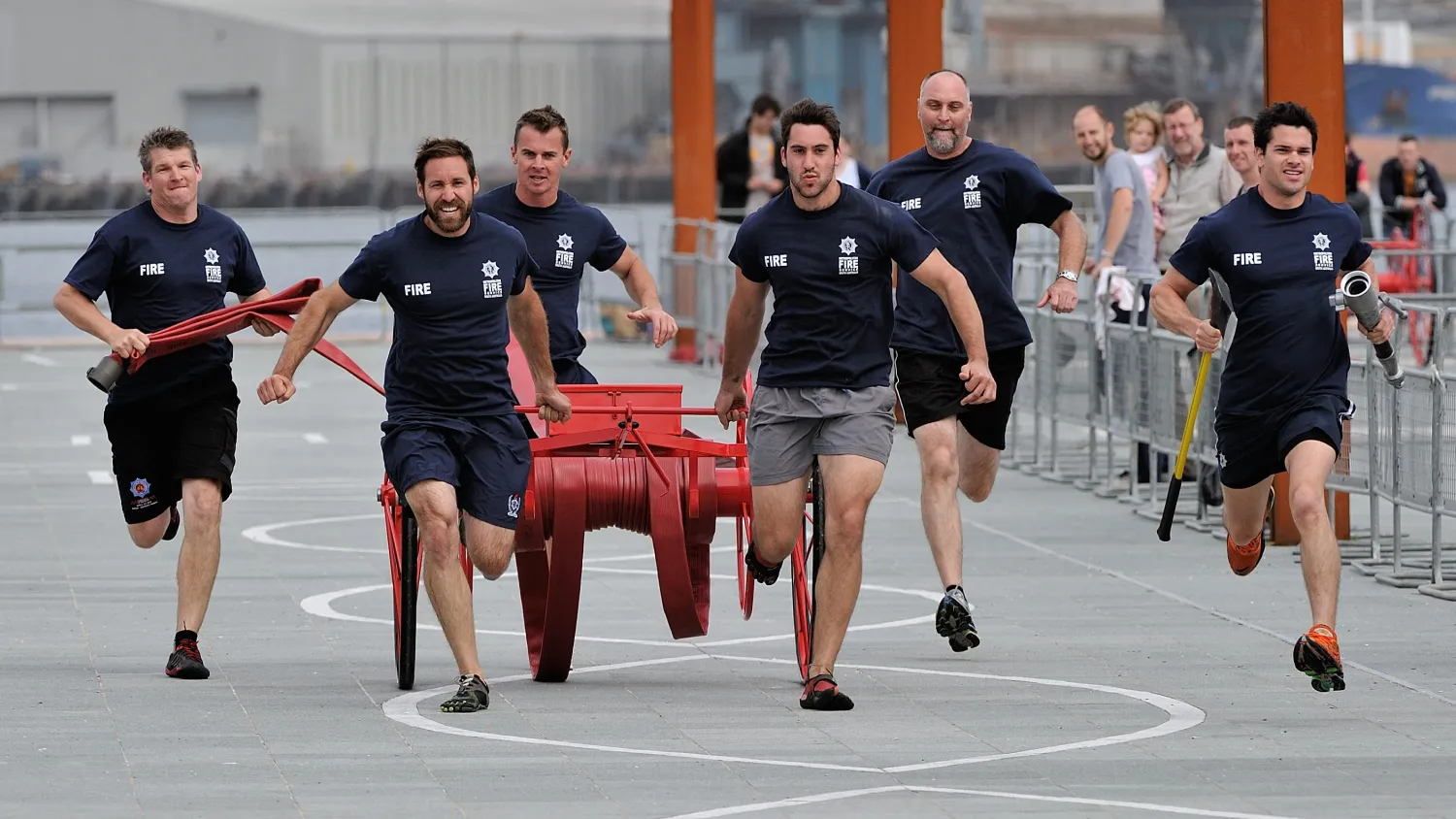 Firefighters competing in a physical challenge at the World Police and Fire Games