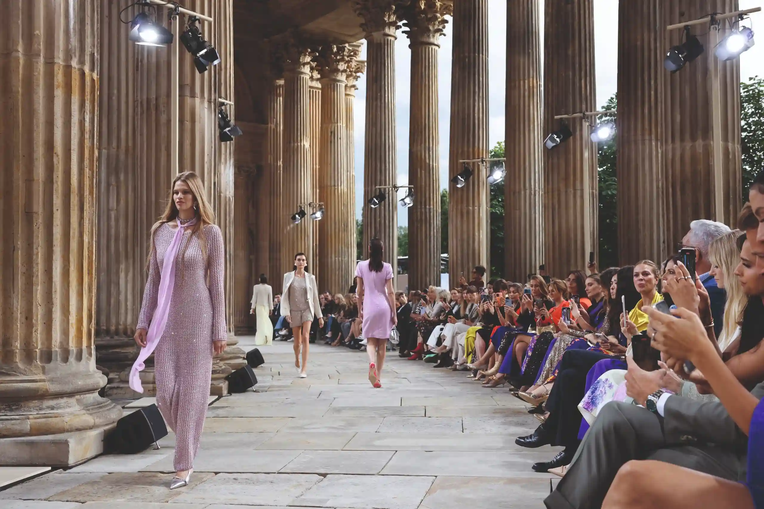 A model walking down the runway during a Berlin Fashion Week show