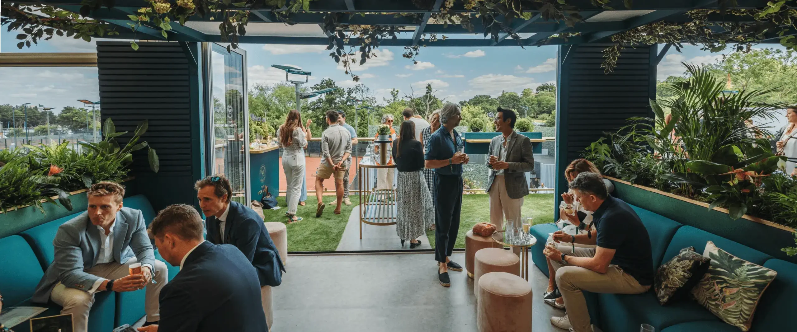 Guests mingling and enjoying the lively, stylish interior of The Treehouse.