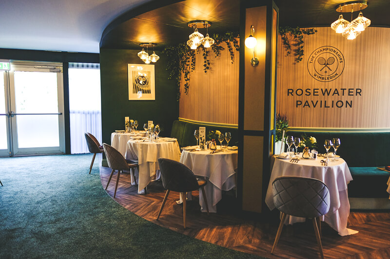 A beautifully arranged long table in a private dining suite, ready to host 24 guests.