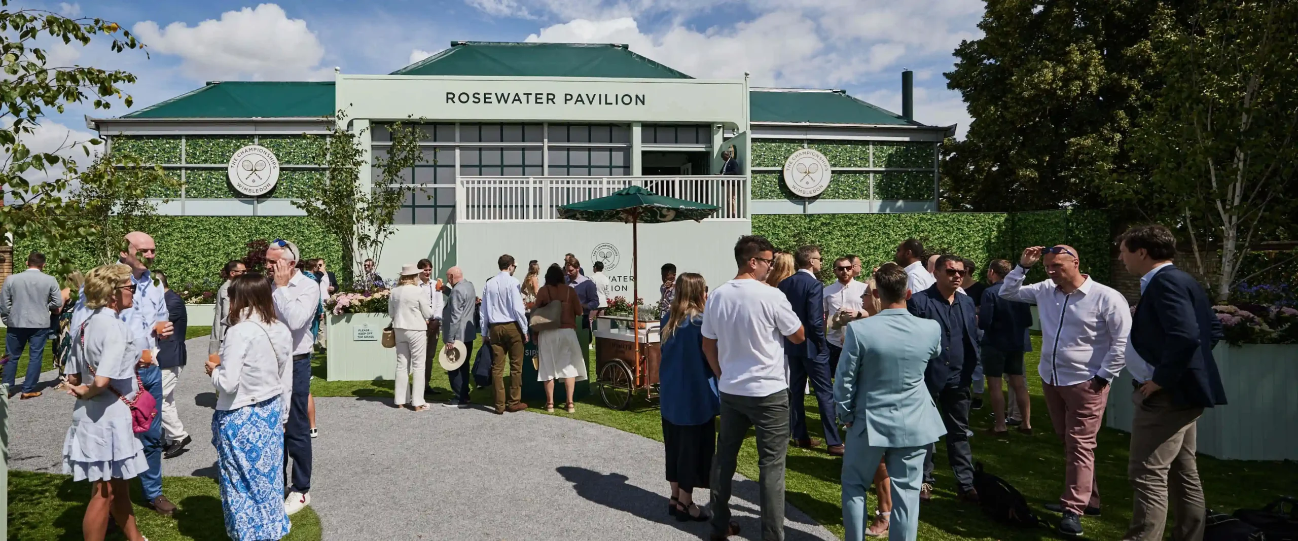 The spacious and bright interior of the Rosewater Pavilion with guests enjoying the lounge area.