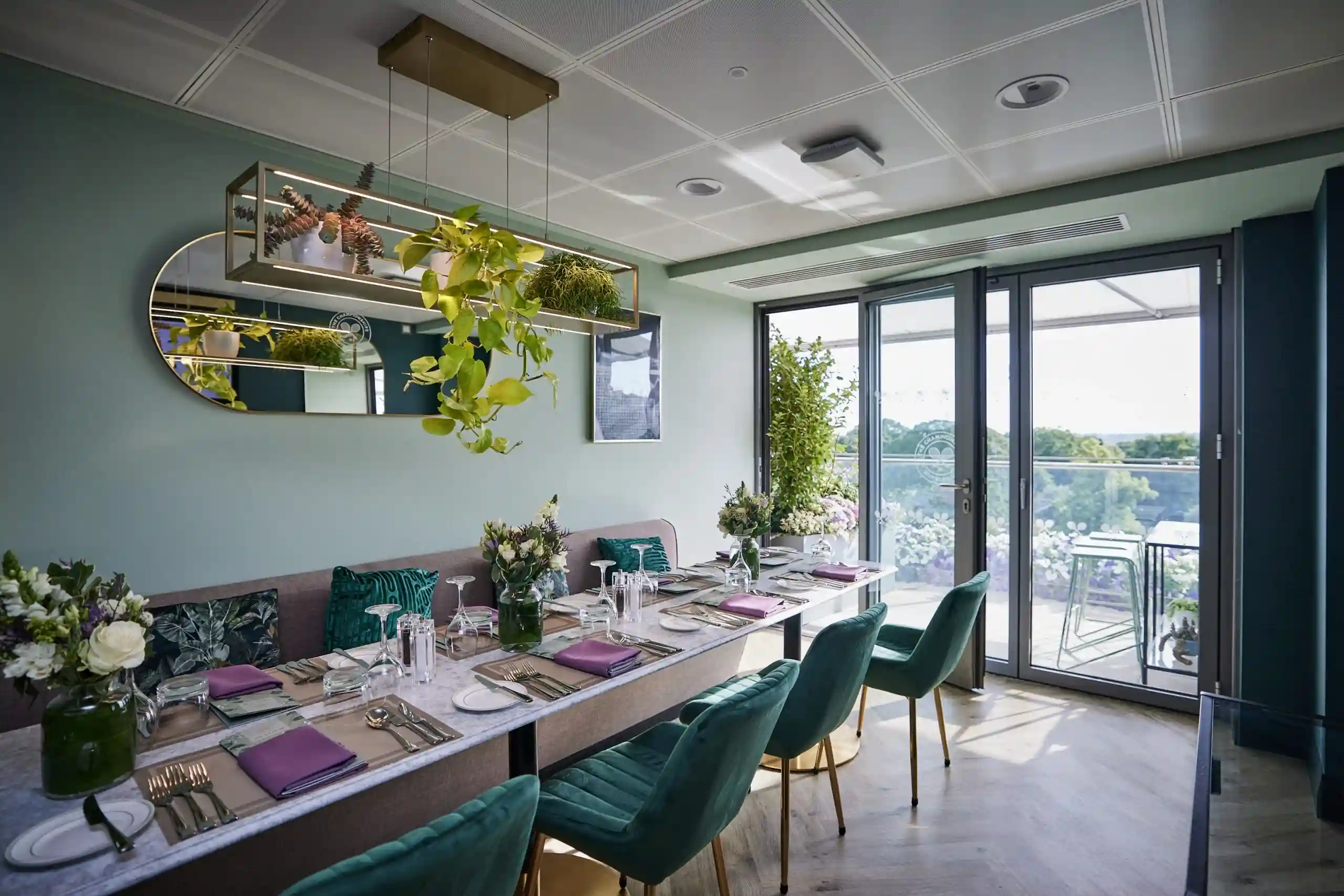 A beautifully set table for ten guests inside a luxurious private suite.