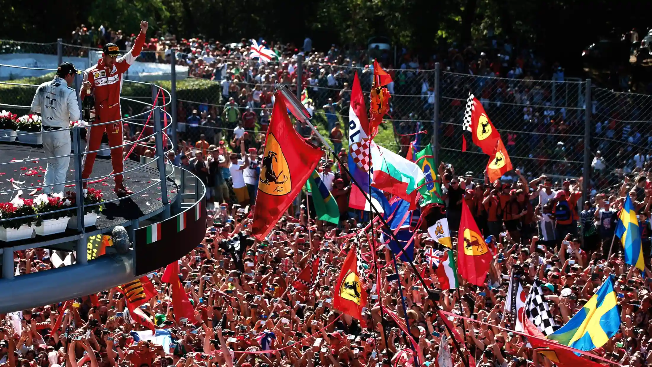 Tifosi celebrating beneath the Monza podium